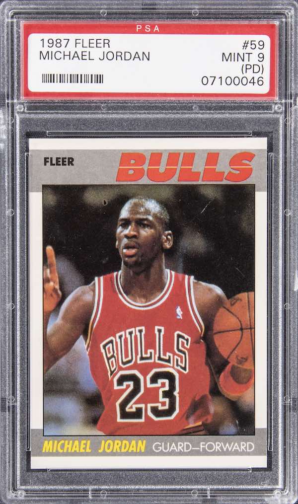 Example of PSA PD qualifier: 1987 Fleer Michael Jordan #59 graded PSA 9 MINT (PD) due to print circle left of head.